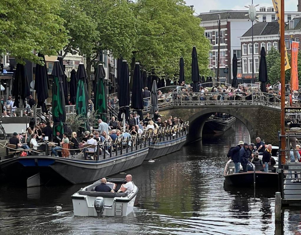 Dutch canal with people on boats