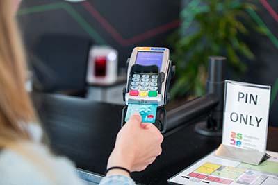 Student paying with bank card