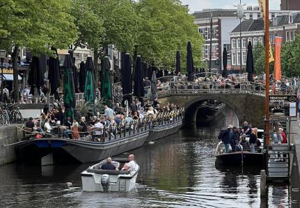 Dutch canal with people on boats