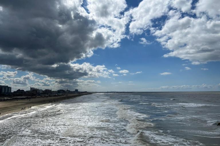 Coastline with half cloudy sky